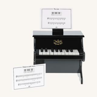 Black Wooden Piano with Sheet Music
