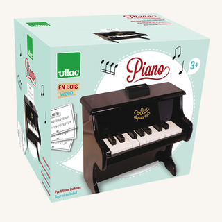 Black Wooden Piano with Sheet Music

